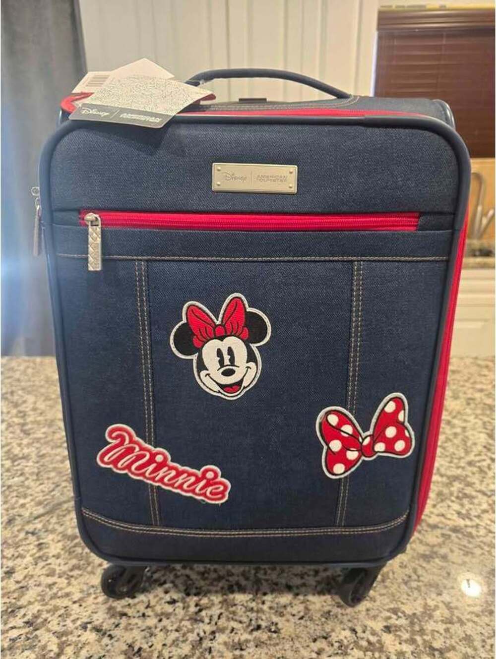 American Tourister Disney Minnie Mouse Denim Krush Spinner Suitcase.